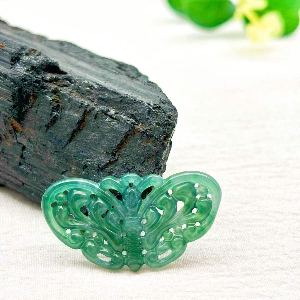 This jade pendant is hand-carved and polished.