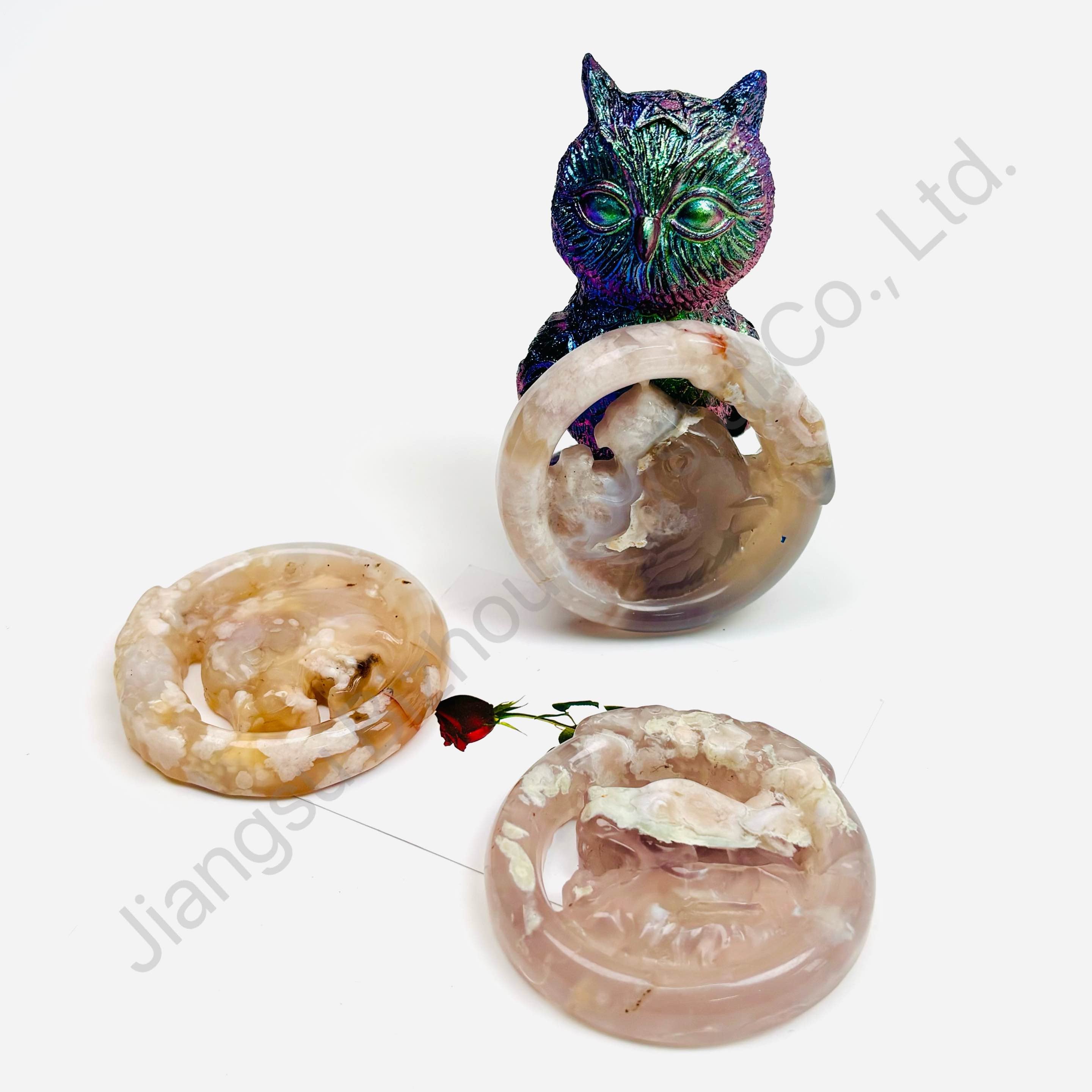 Purely hand-carved round agate pendant with alternating pink cherry blossom and agate patterns.